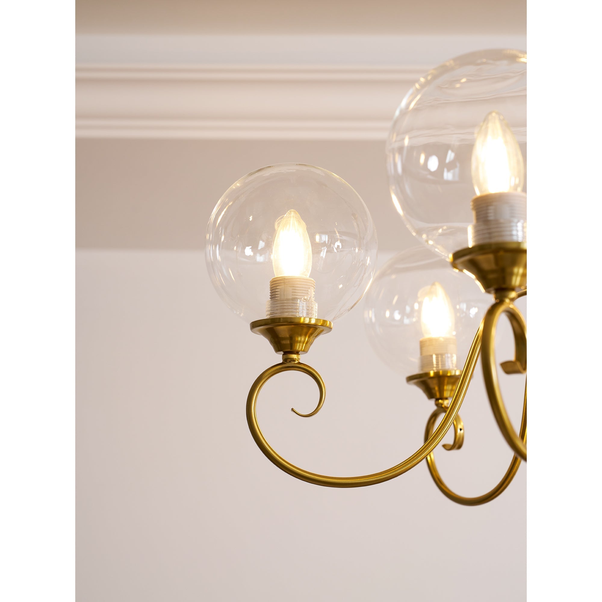 The chandelier as a statement piece in a minimalist room.