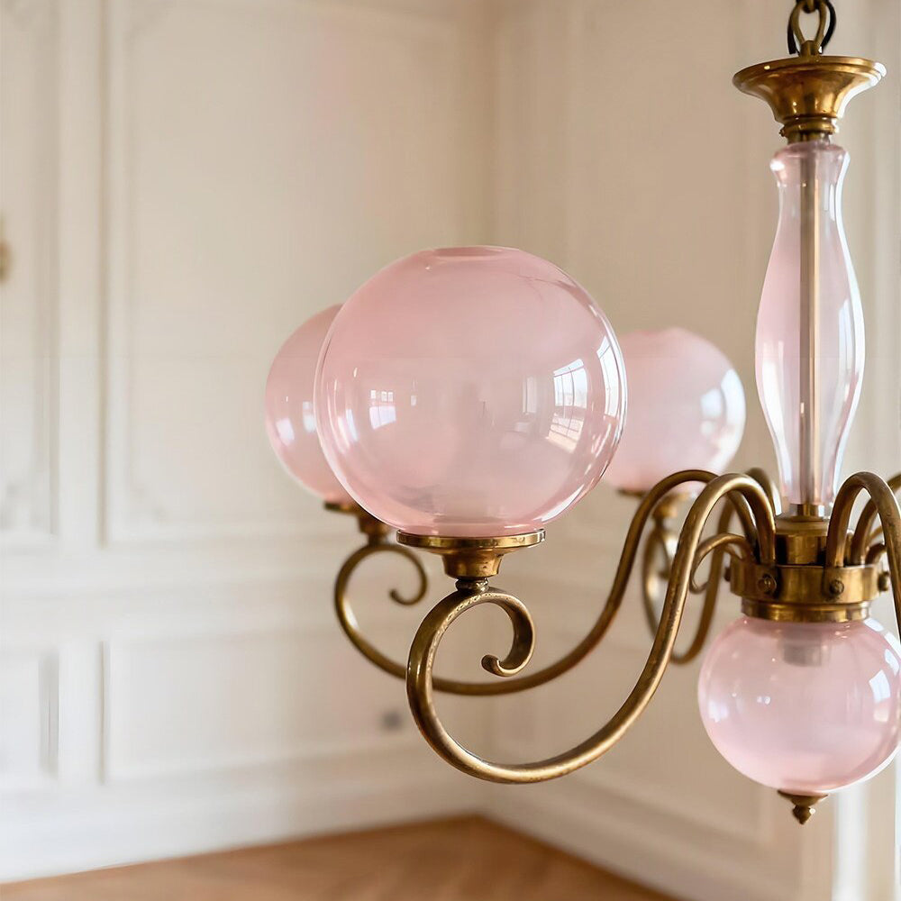 The 8+1 head configuration of the Evelyn Chandelier in a grand dining room.
