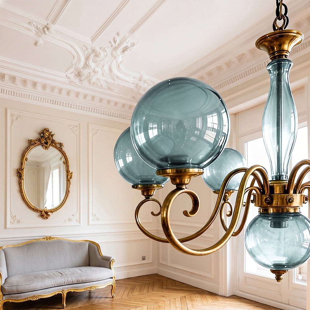 Detail shot of the hand-aged antique brass finish on the chandelier frame.