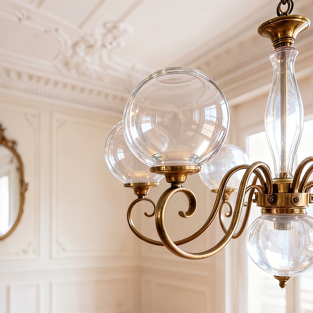 The Evelyn Chandelier hanging over a wooden dining table.