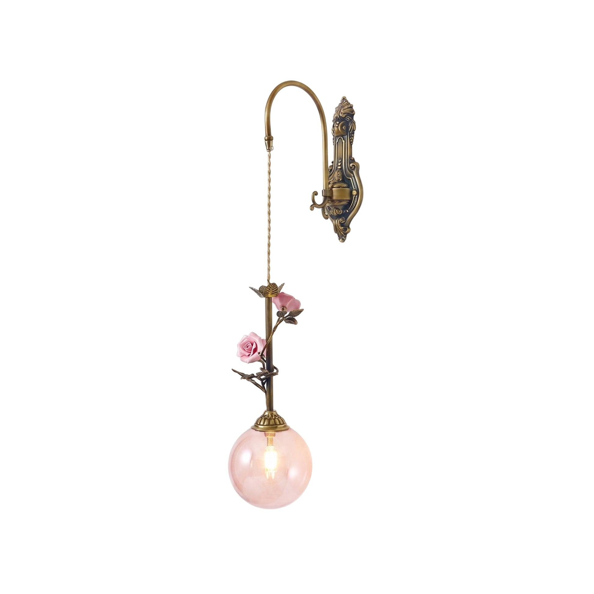 Evelyn Glass Rose Wall Sconce in pink against a neutral wall.