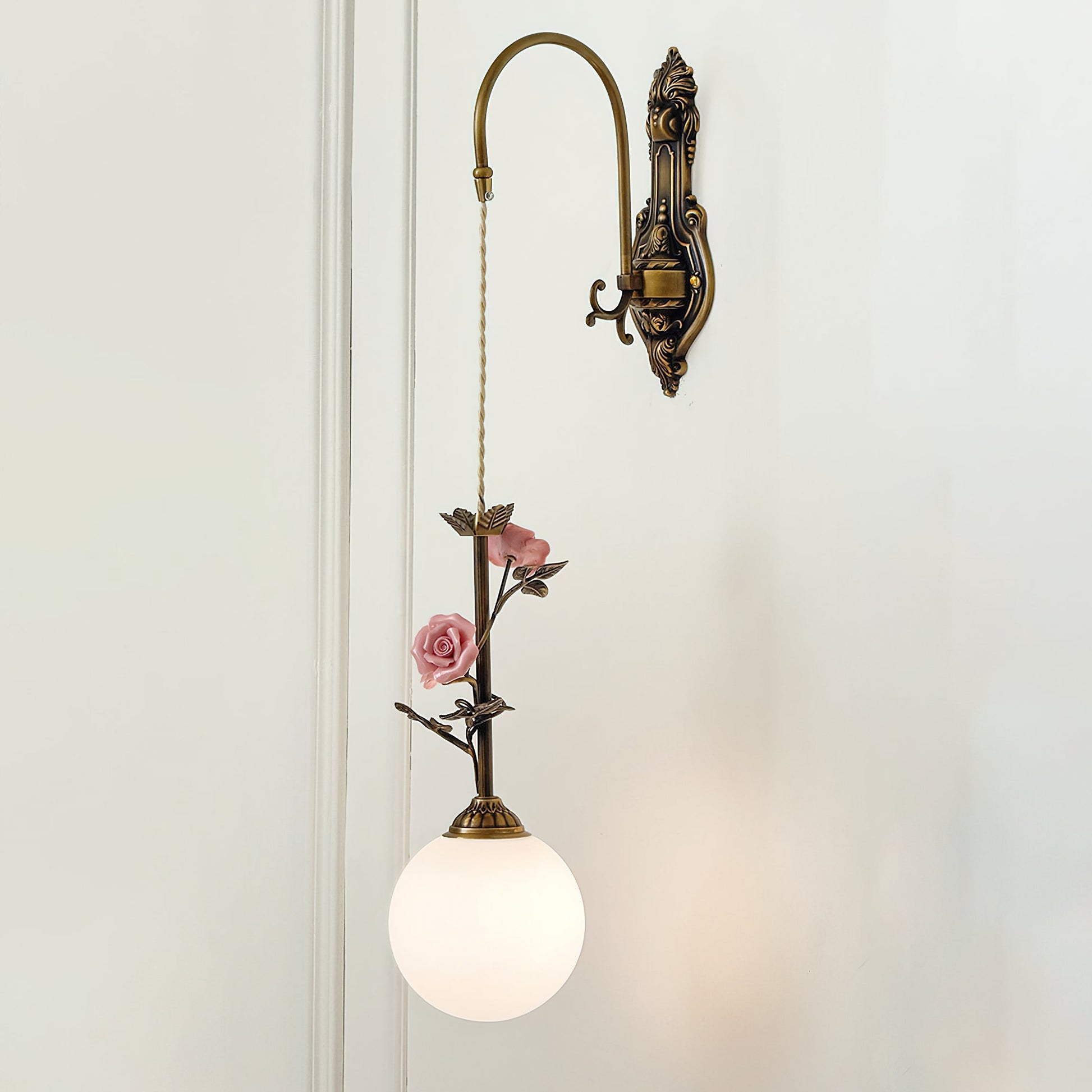 Lifestyle photo showing the sconce in a beautifully decorated bedroom.