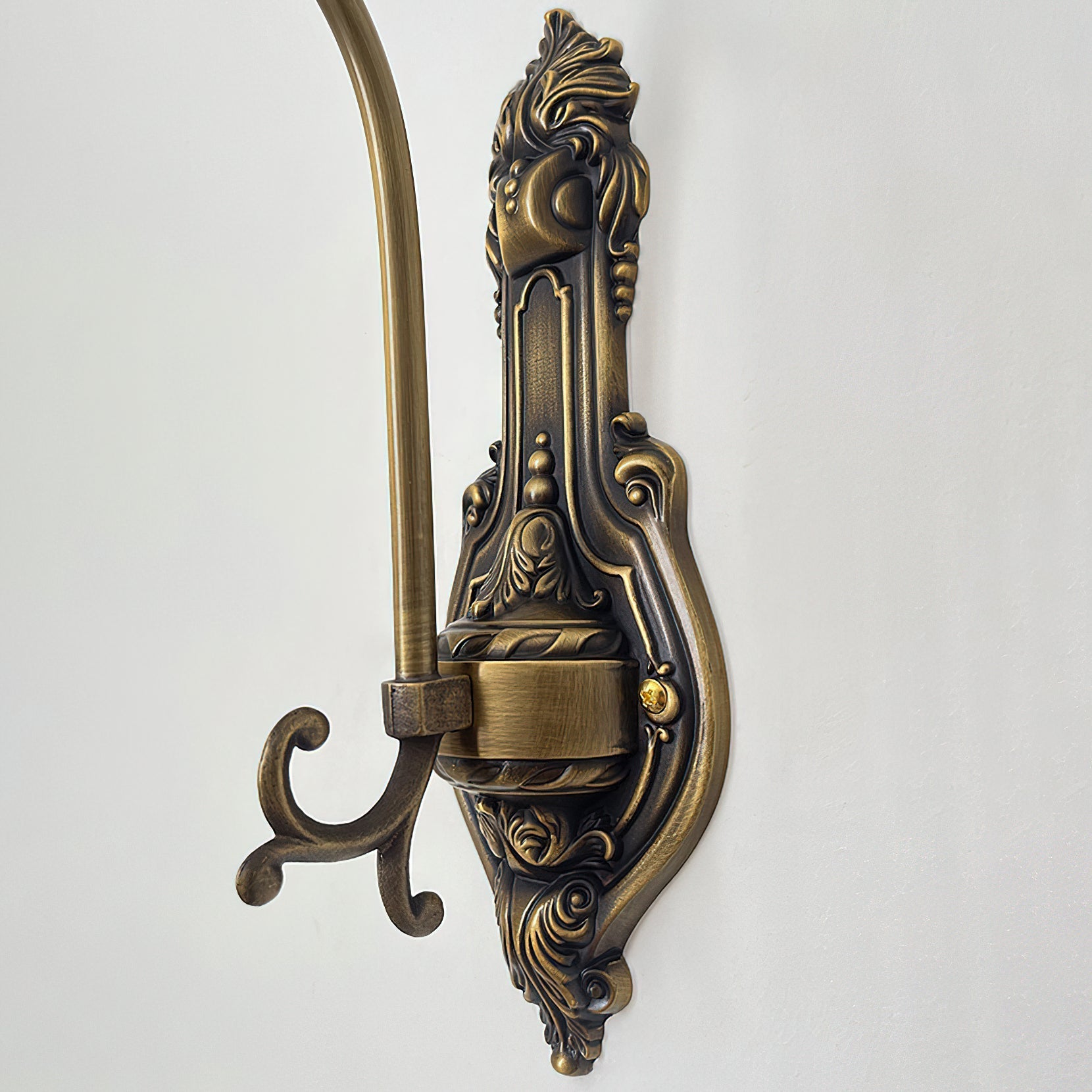 The clear glass rose sconce, unlit, showcasing its form.