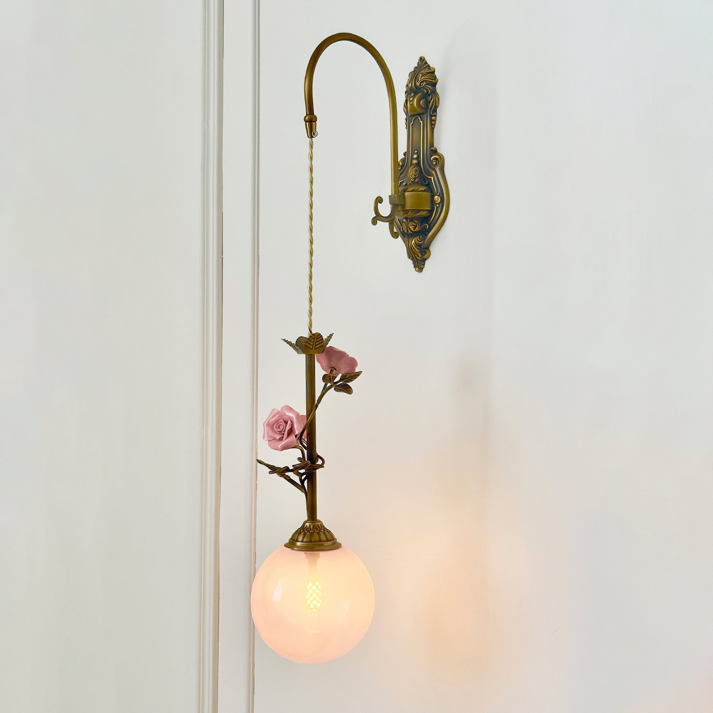 View of the back panel and mounting plate of the wall sconce.