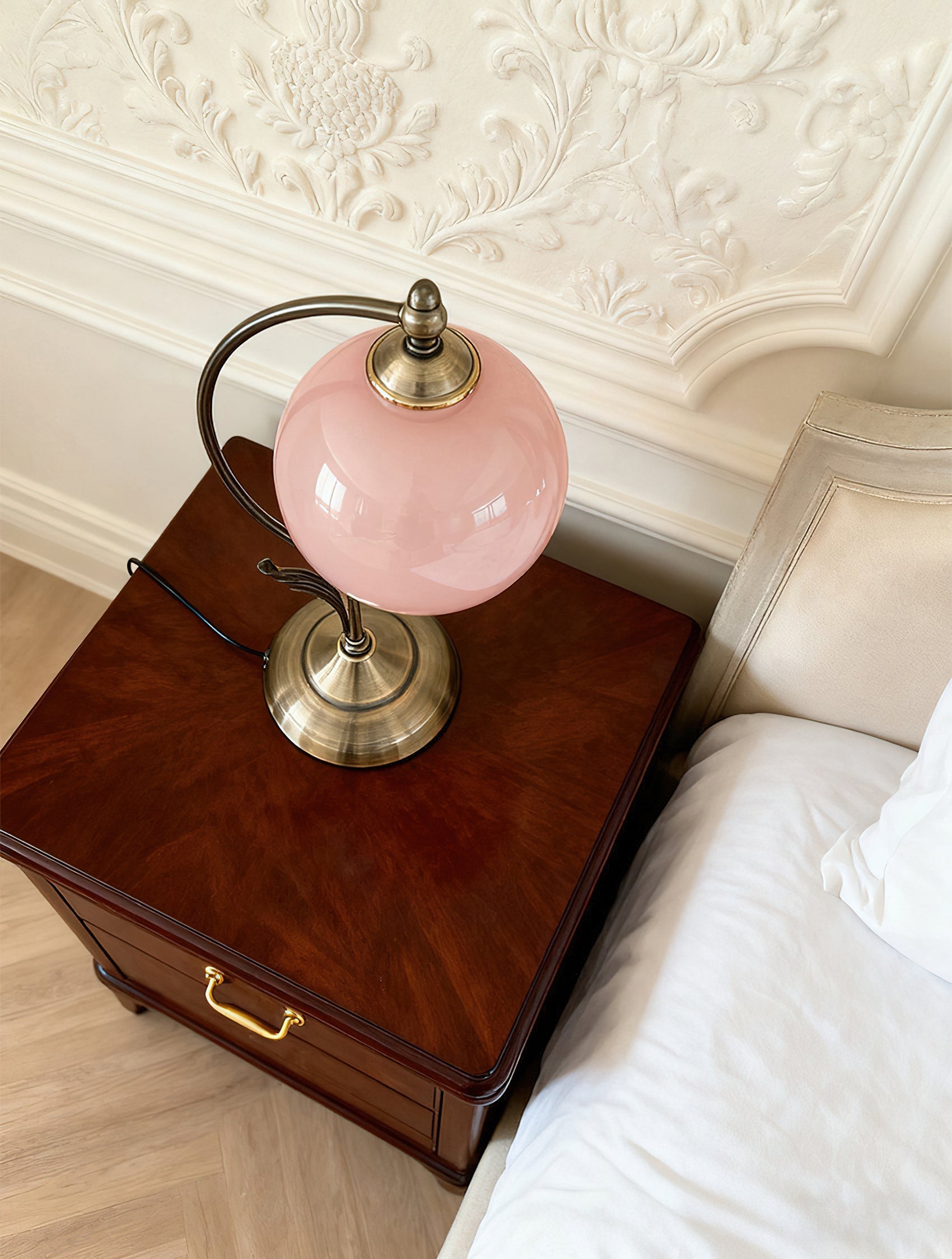 Close-up of the soft-pink glass sphere on the Evelyn Table Lamp.