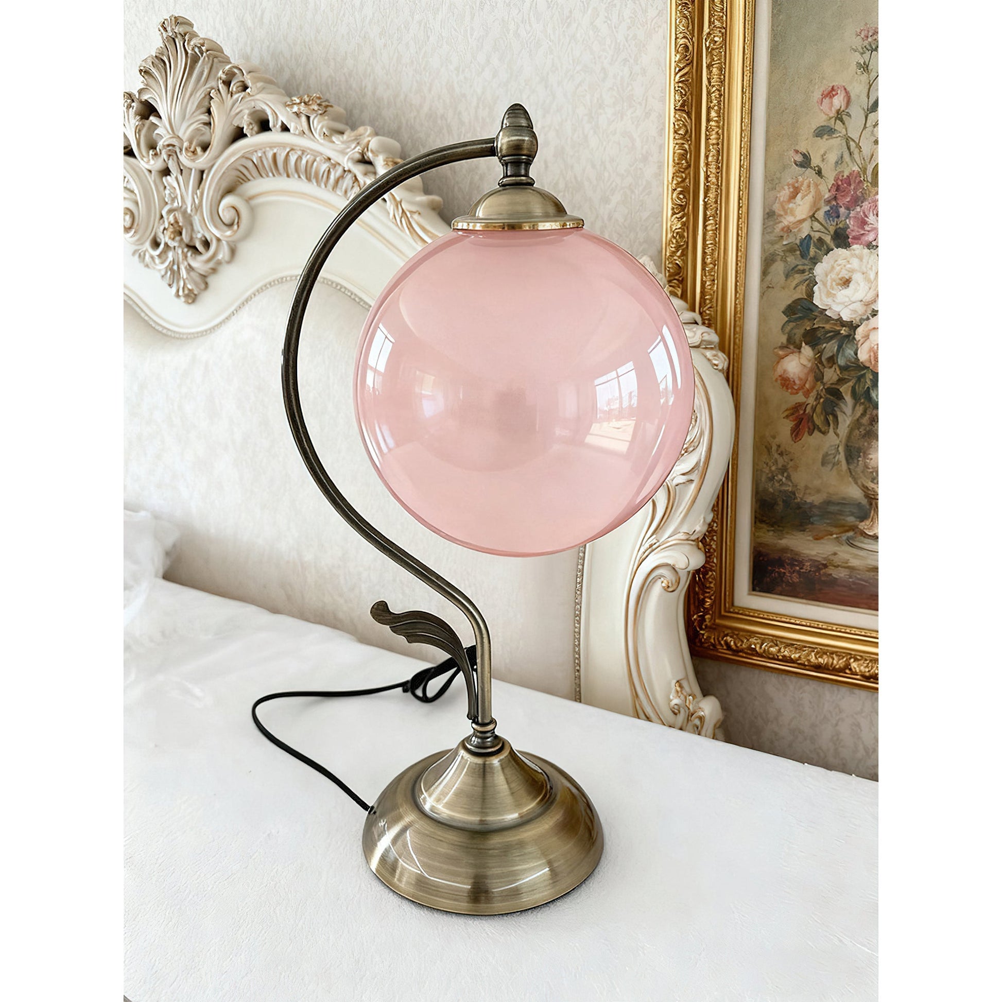 Evelyn Table Lamp with a clear glass sphere.