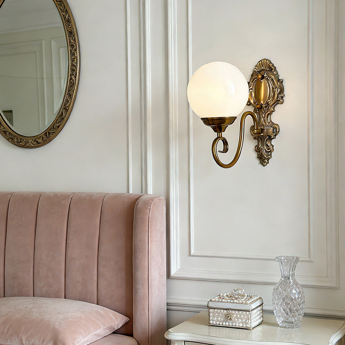 Close-up detail of the intricate brass-finished metalwork on the Evelyn Wall Lamp.
