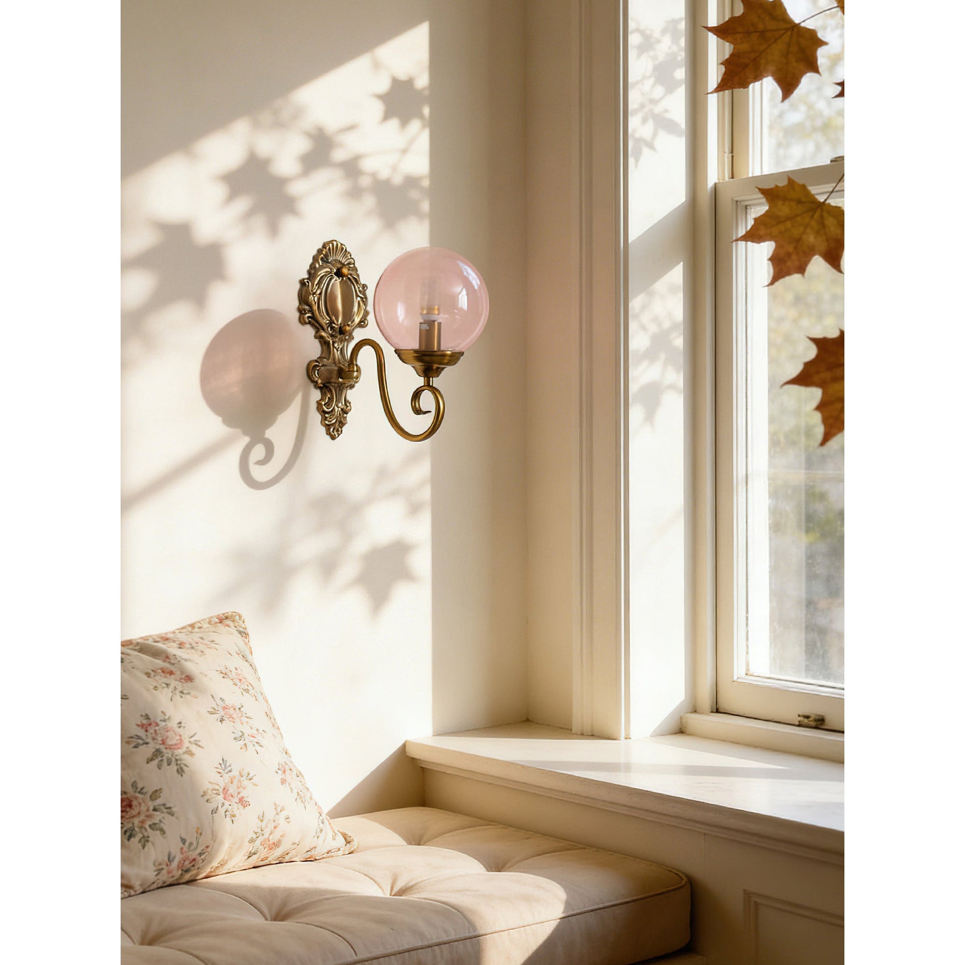 Front view of the Evelyn Glass Wall Lamp with a pink glass shade.