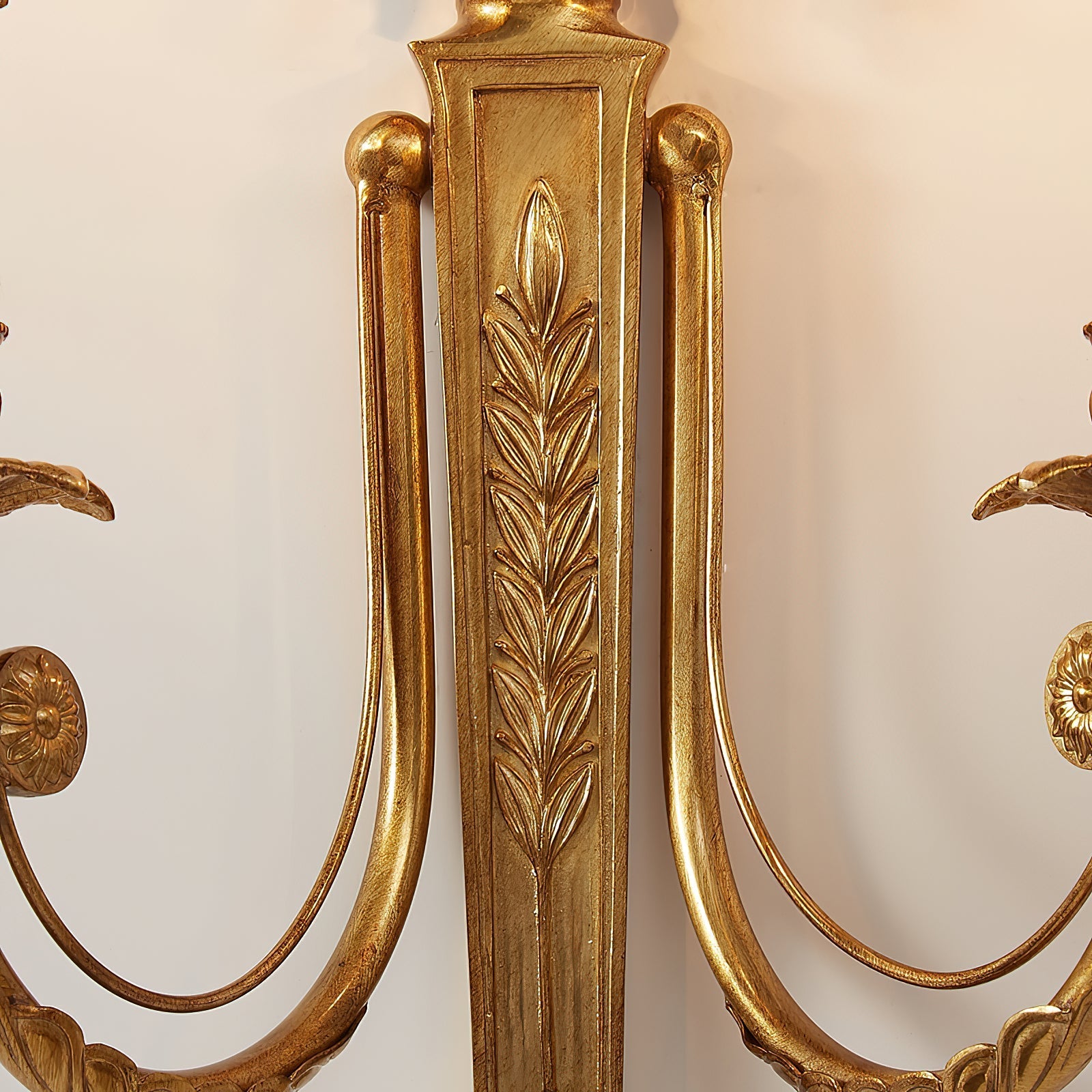 A shot highlighting the elegant curvature of the lamp's brass arms.