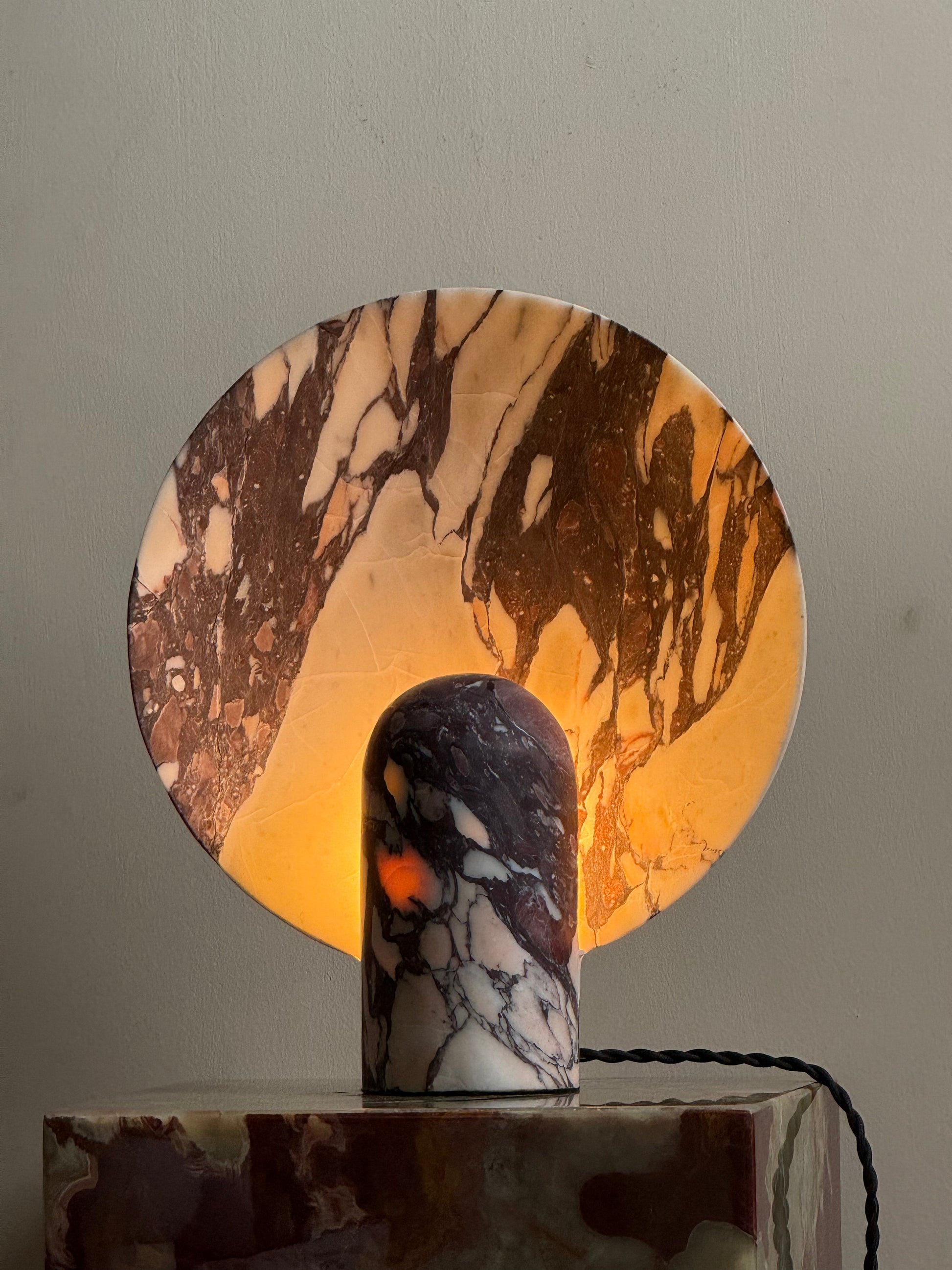 Angled view of the black marble Fan Table Lamp.