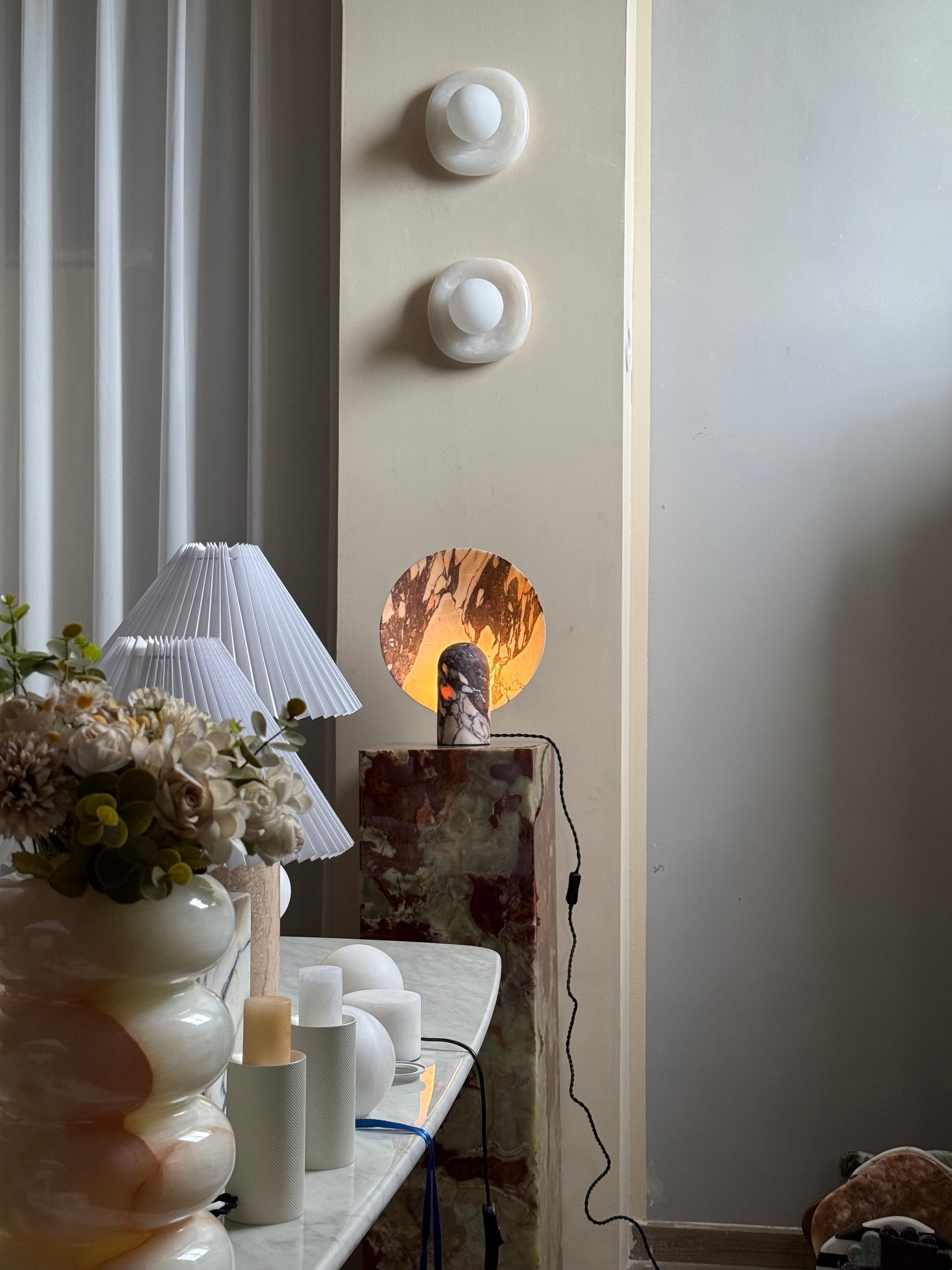 Close-up of the white marble base of the Fan Table Lamp.