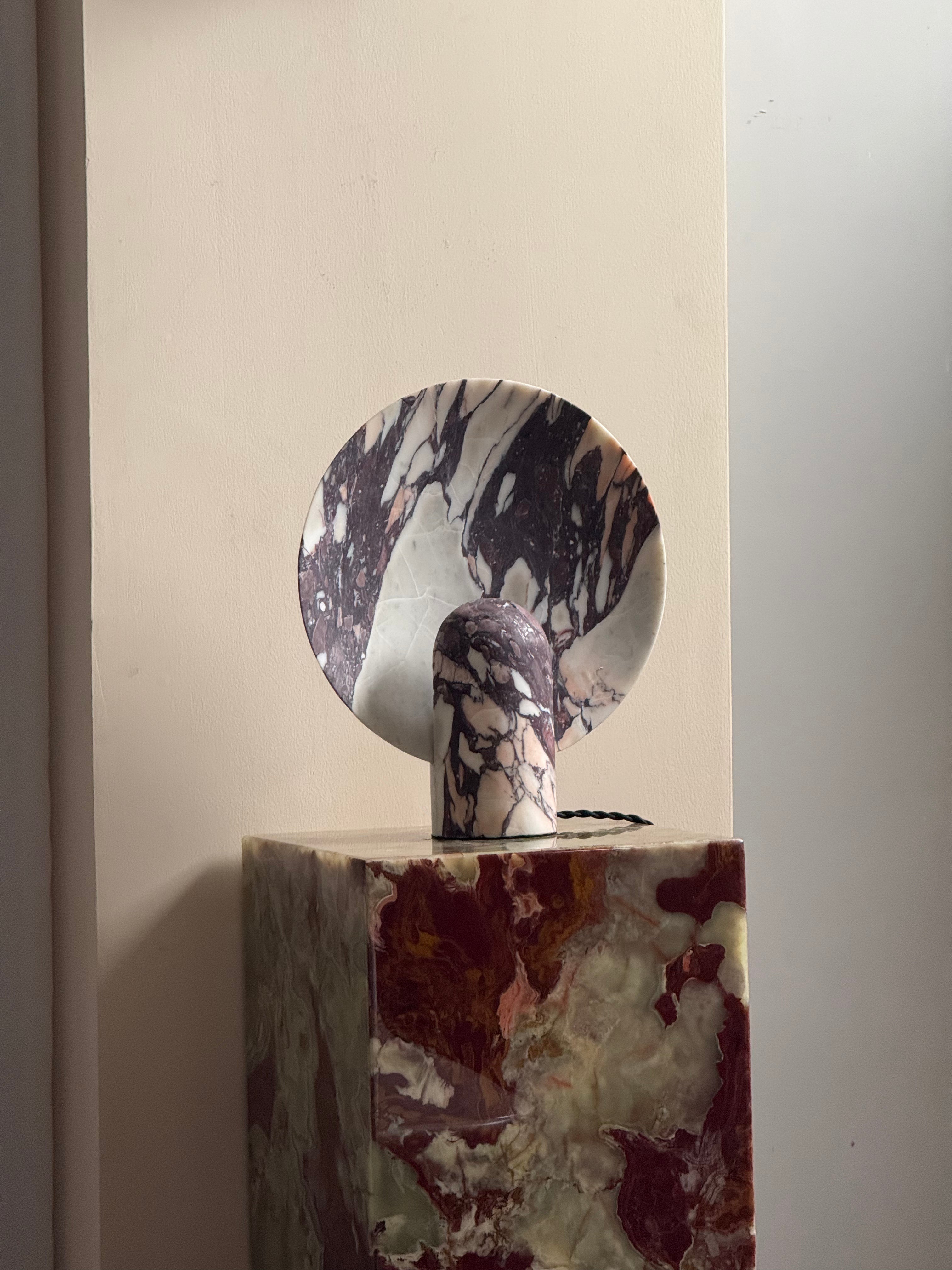 The sculptural silhouette of the Fan Marble Table Lamp in black.