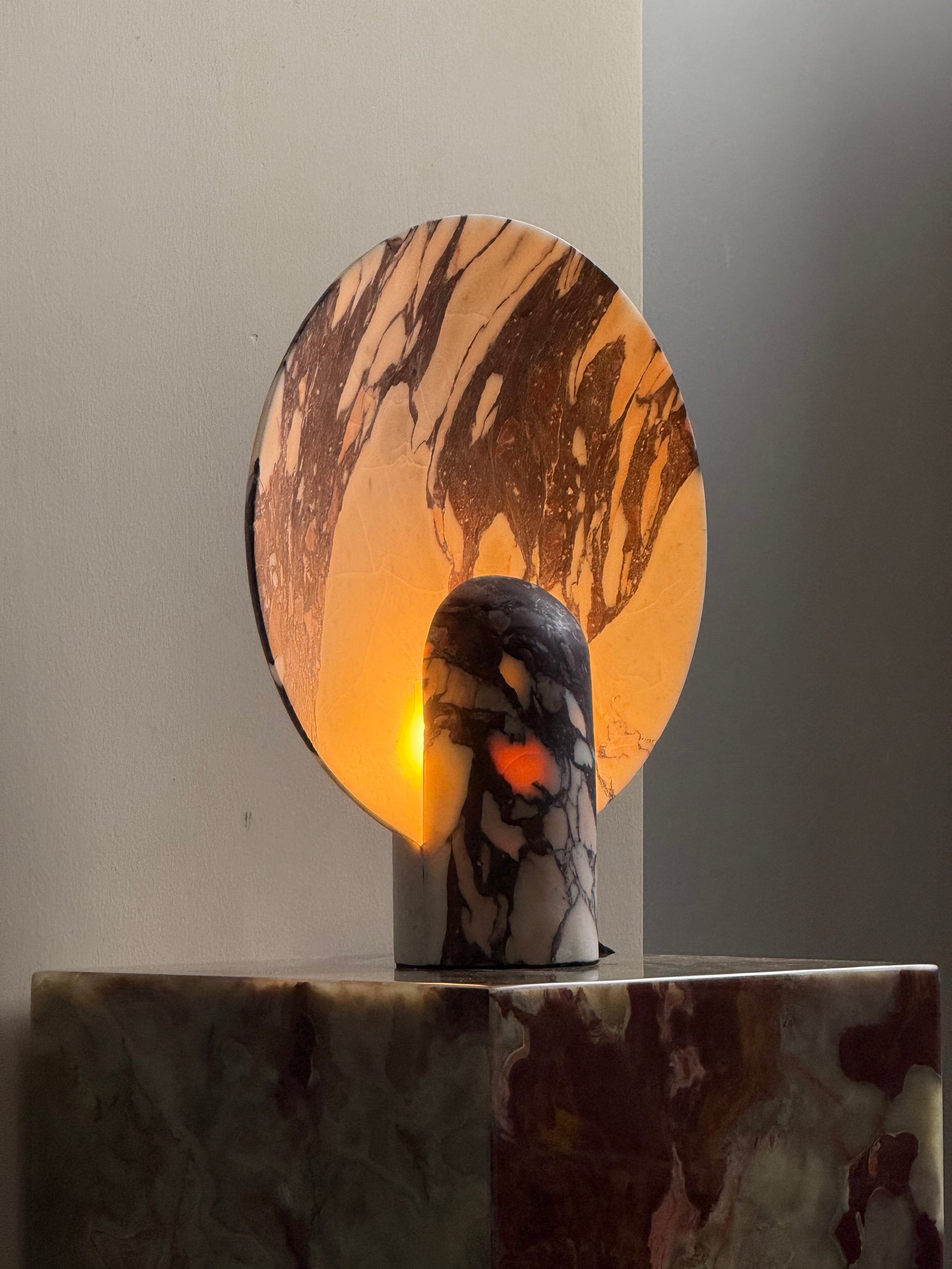 Fan Table Lamp casting a warm, ambient glow on a side table.