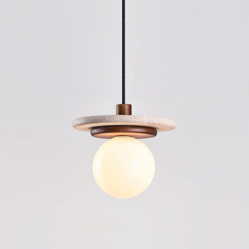 View of the pendant light from below, revealing the G9 bulb base inside the glass globe.