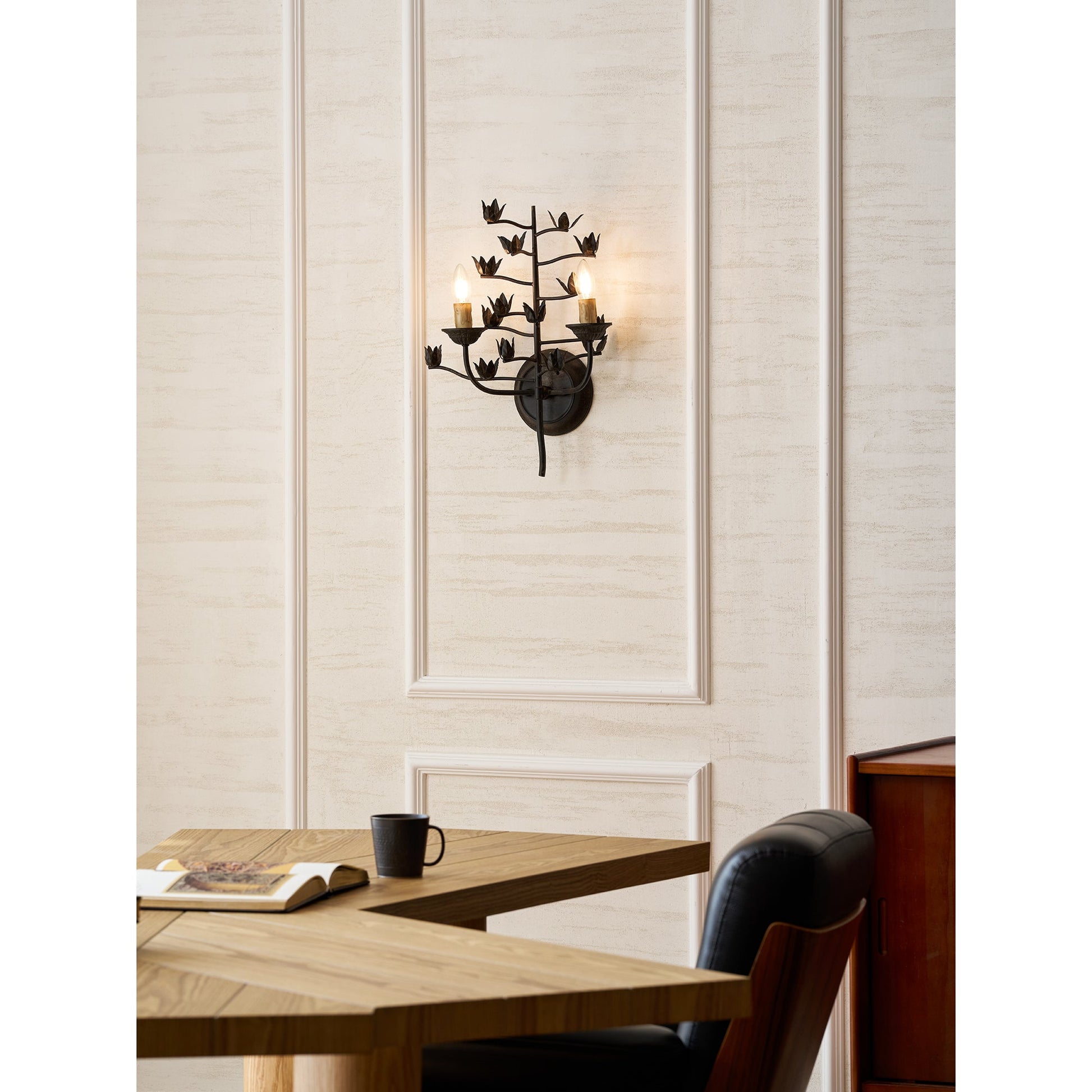 The two light heads of the branch wall lamp, unlit.