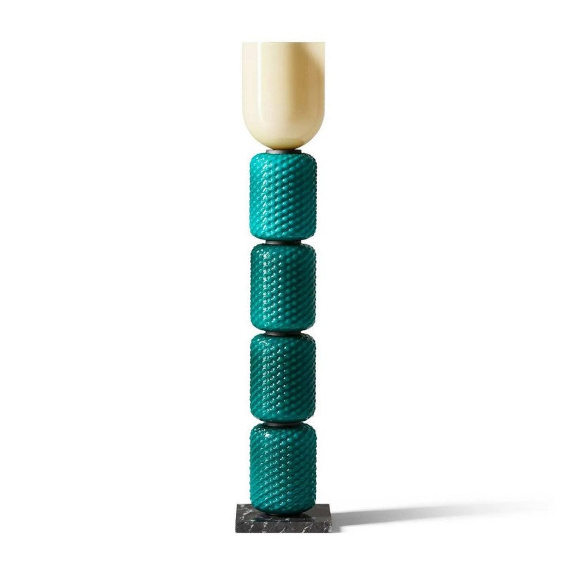 The connection point between the glass body and the marble base.
