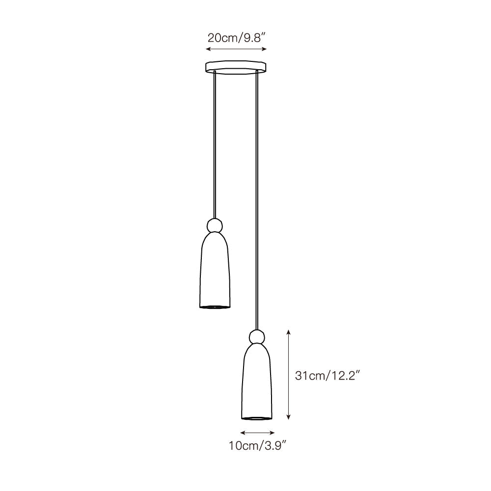 The pendant light hanging as a single drop, casting a warm, diffused glow.
