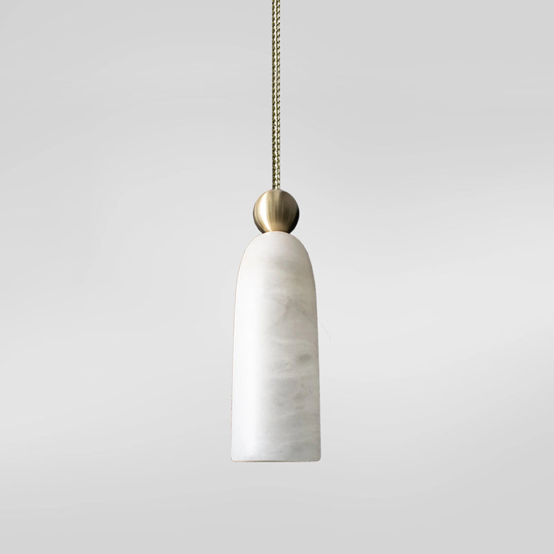 Figure pendant light used as a stylish bedside lamp.