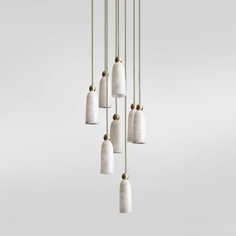 A single Figure pendant illuminating a cozy reading nook.