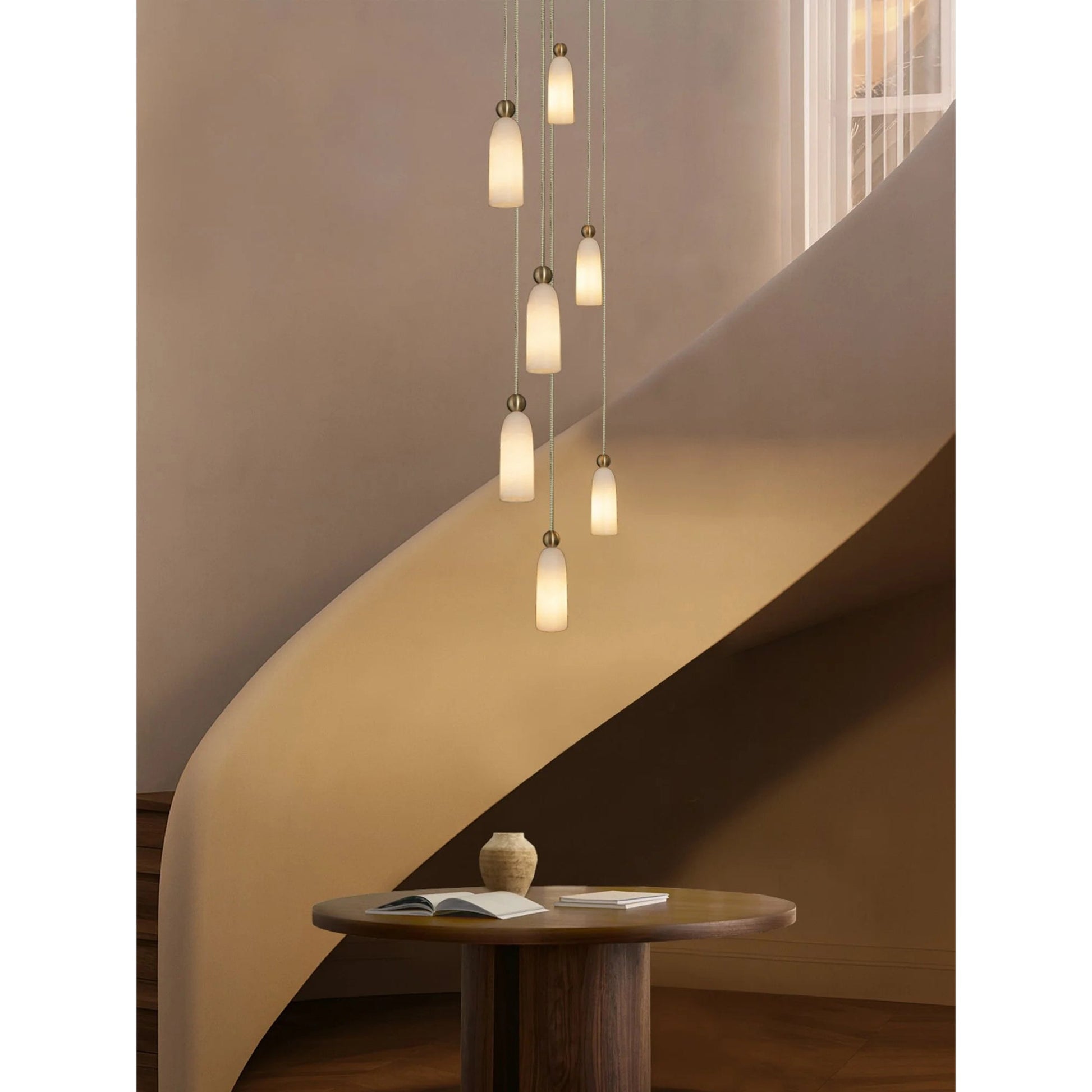 A row of single Figure pendants installed in a commercial space.