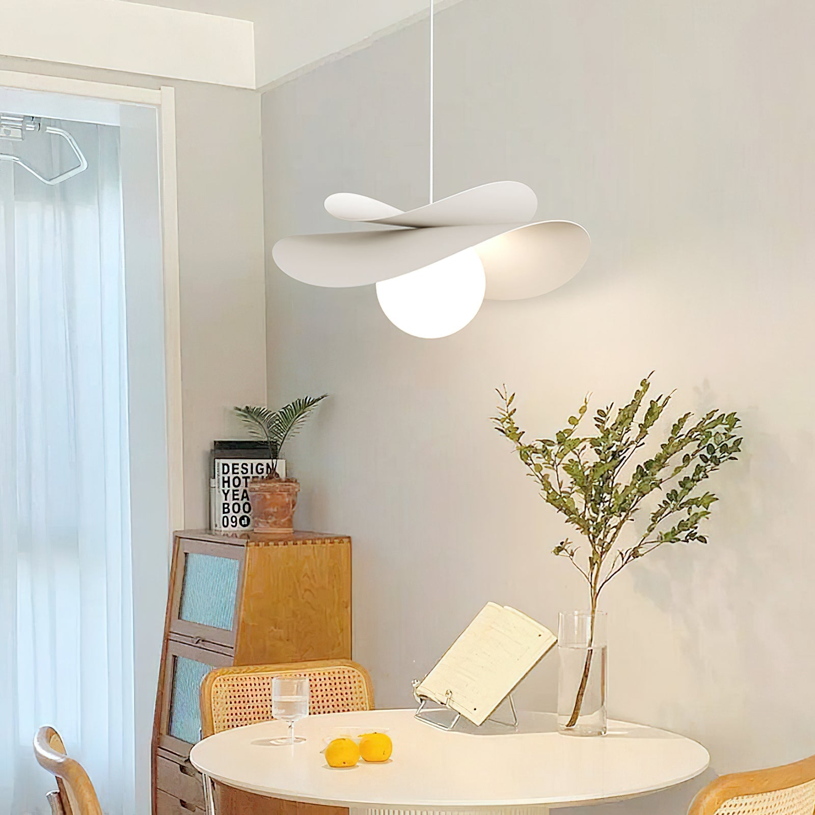 Detail shot of the ceiling mount and adjustable wire for the Fiksa Pendant Lamp.