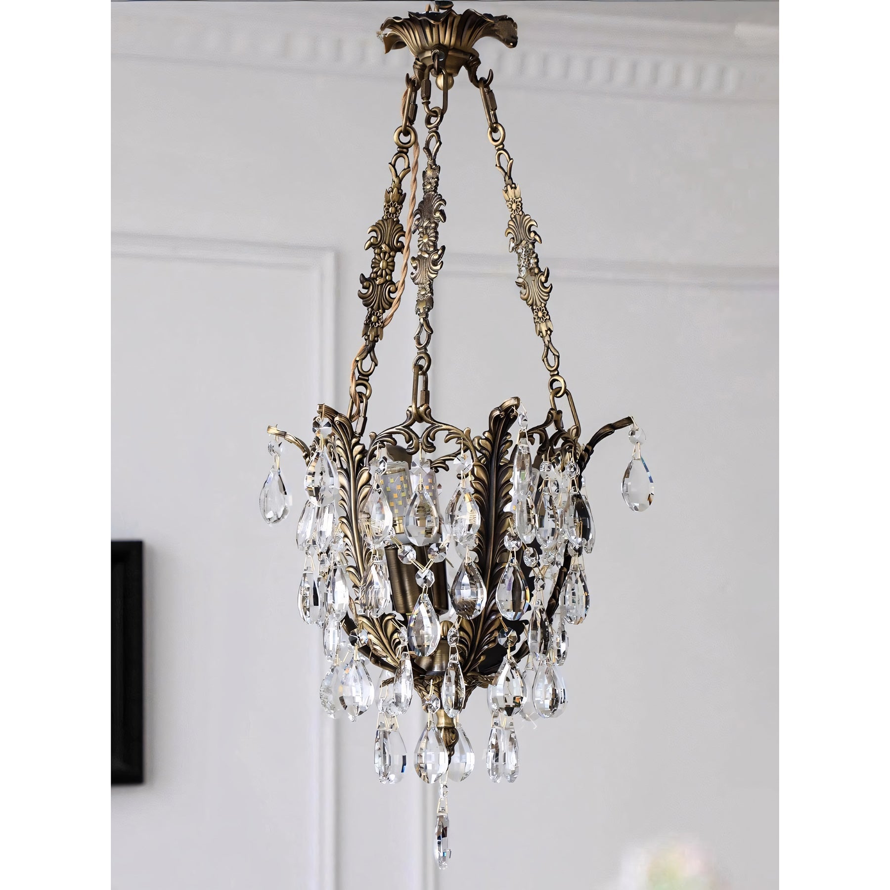 Another angle of the chandelier in a home interior.