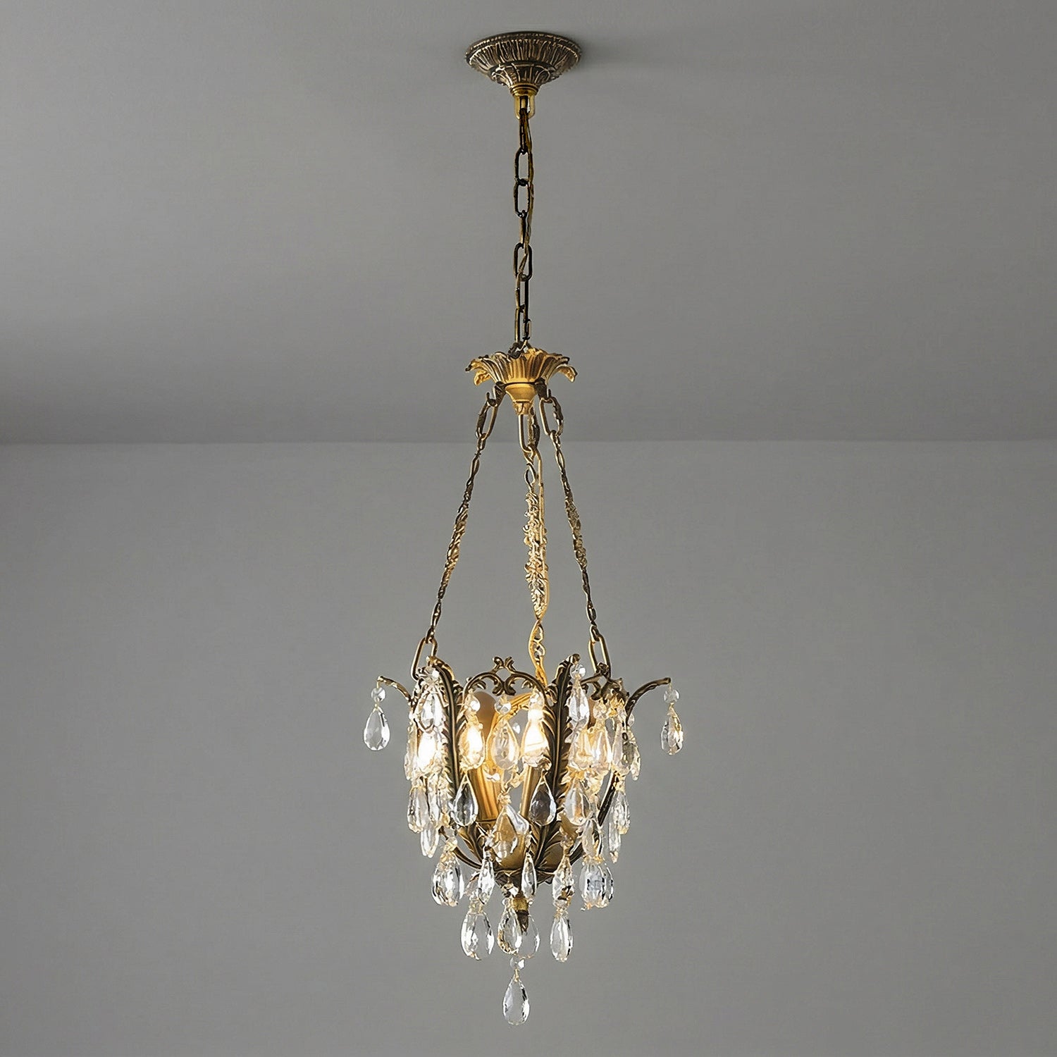 Top section of the chandelier showing the brass structure.