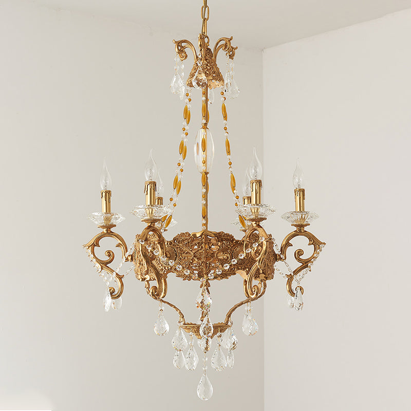 The brass and crystal components of the chandelier in detail.