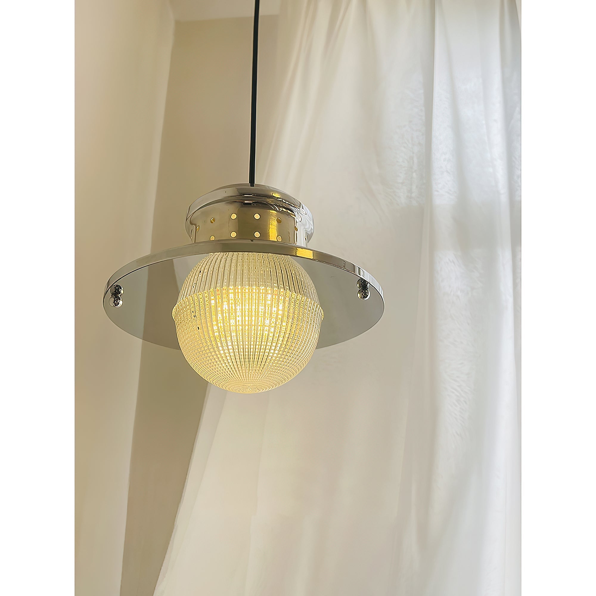 The Fisherman's Pole Pendant Lamp shown illuminated, casting a warm glow.