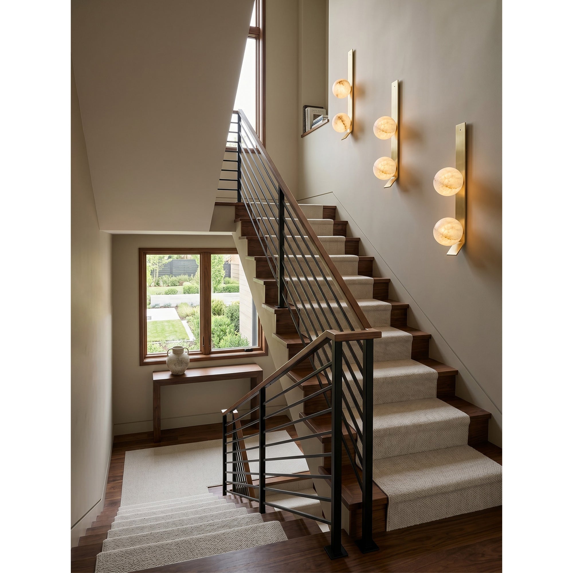 Unlit view of the Fizi wall sconce, highlighting the contrast between alabaster and brass.