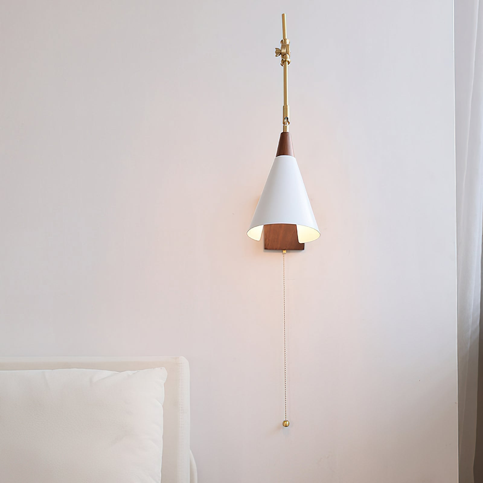 Detail shot of the white lamp shade and brass hardware.