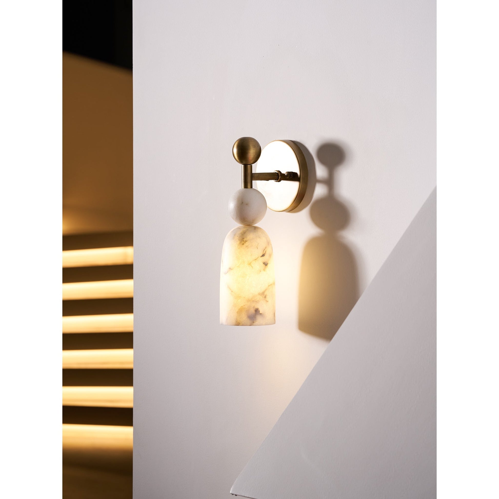 Close-up of the polished brass orb reflecting light.