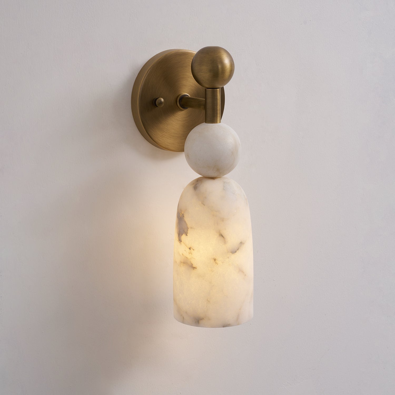 The antique brass finish Flume lamp in a classic, traditional interior.