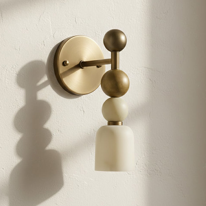 Front view of the Flume Alabaster Wall Lamp with an antique brass finish.