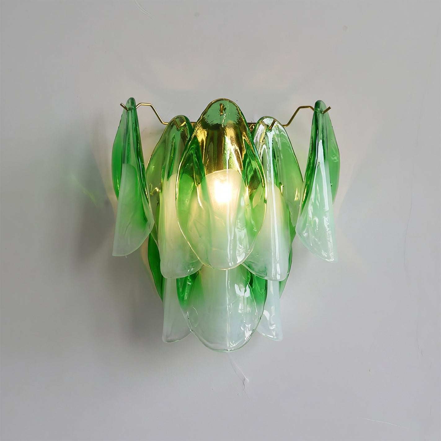 The white glass Foliage Wall Sconce in a bright, modern hallway.