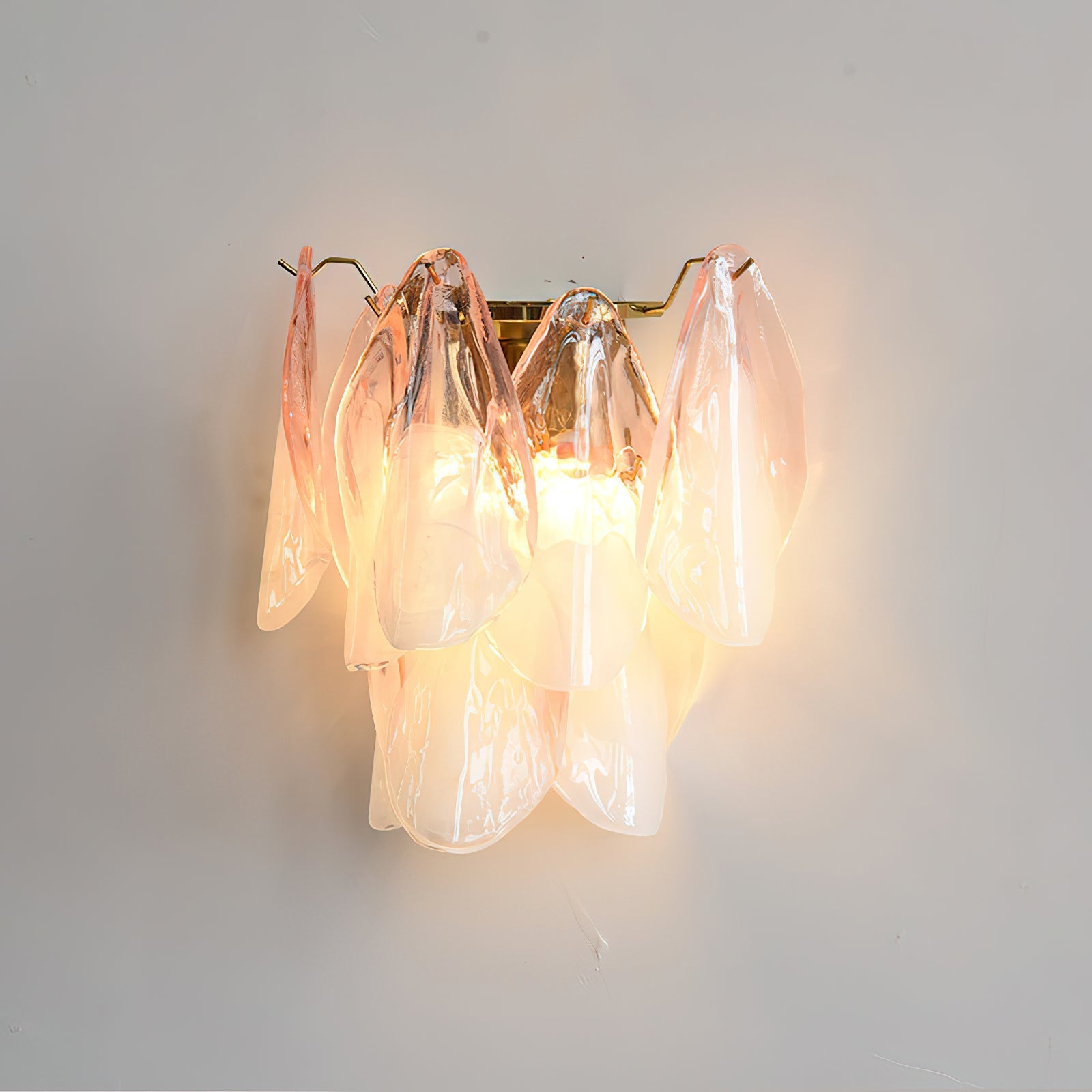 Foliage Wall Sconce in green, installed in a living room setting.
