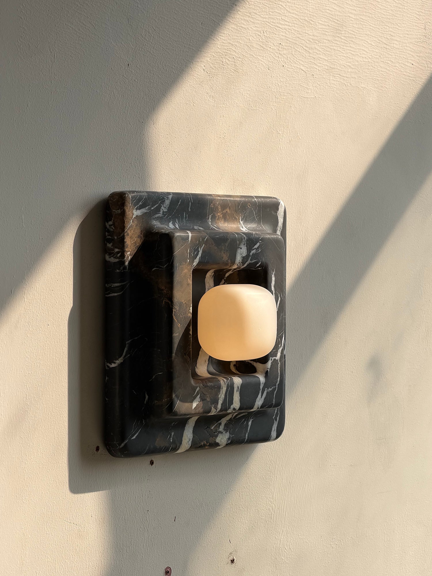 Franklin Marble Wall Lamp in black, front view.