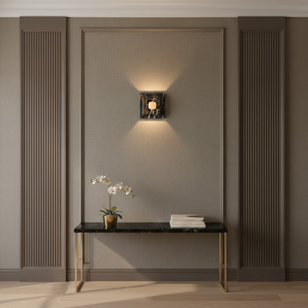 Angled view of the black marble wall lamp.