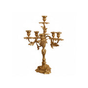 French brass seven-light candelabra on a neutral background.