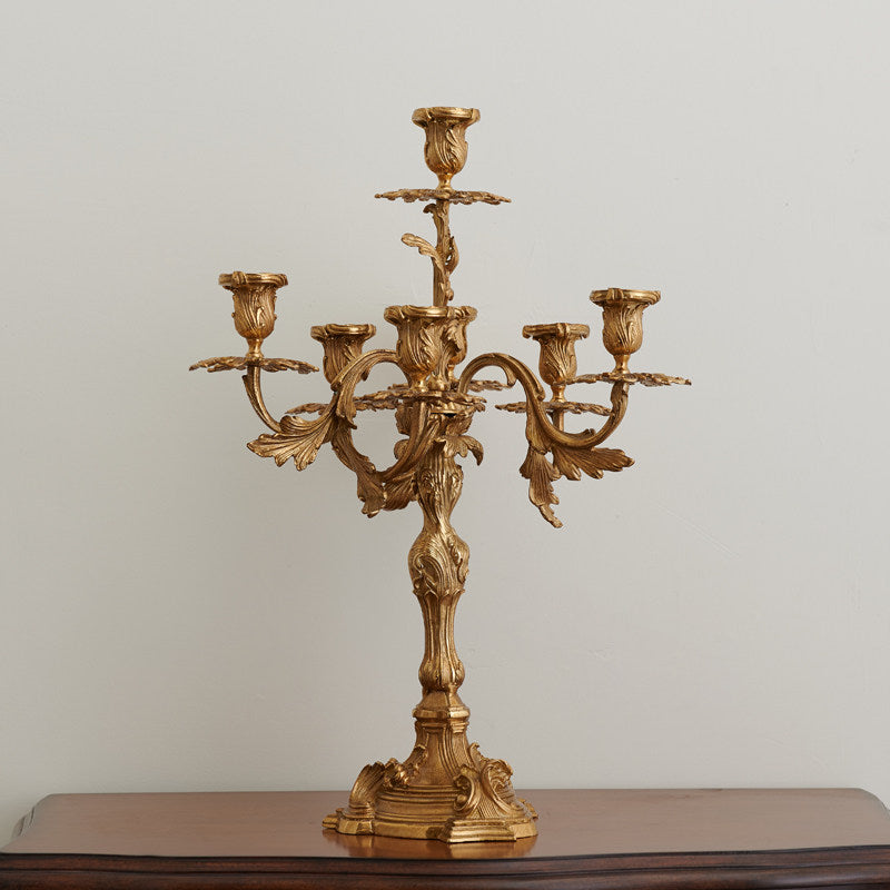 The candelabra silhouetted against a dark background to highlight its shape.