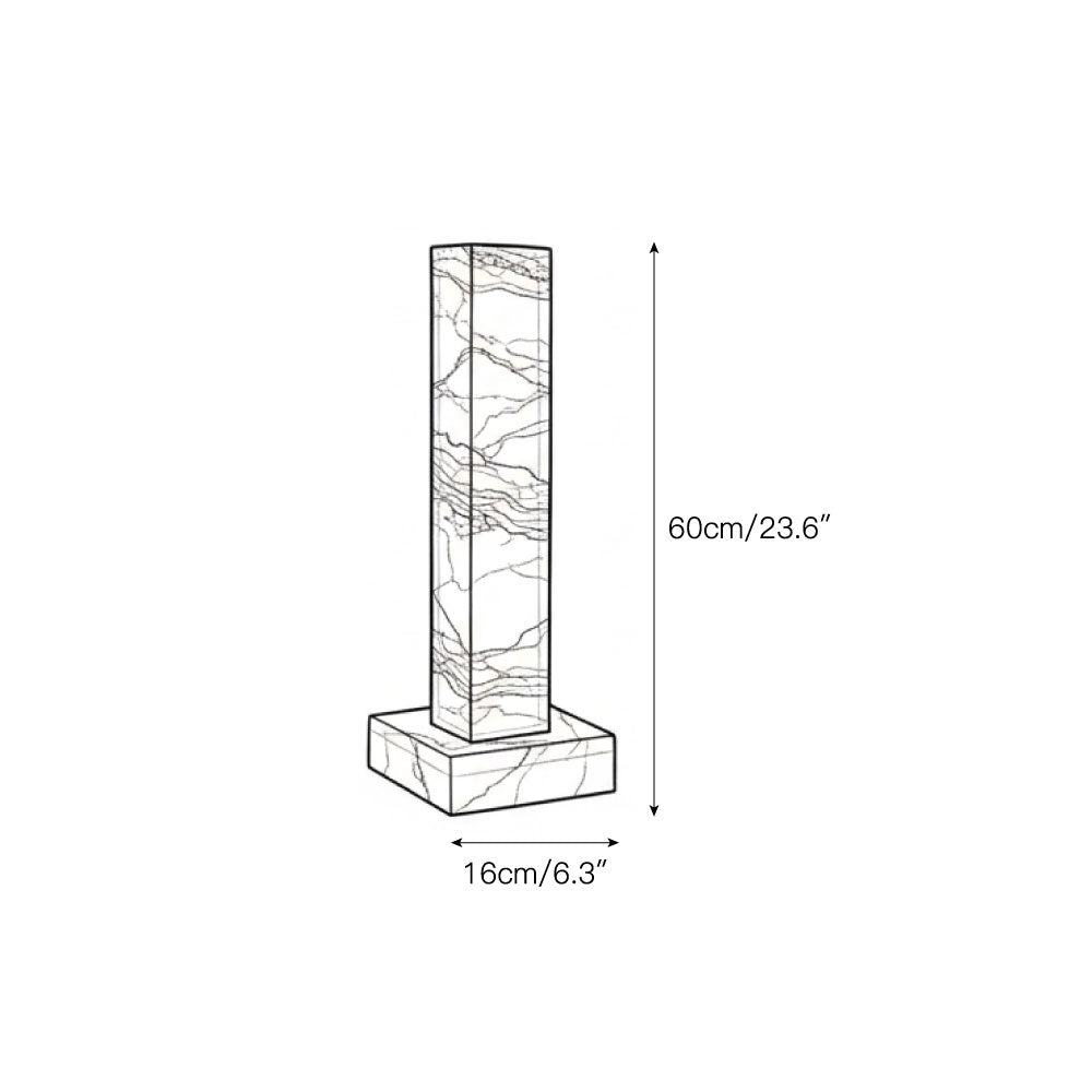 The floor lamp with its marble base on a wooden floor.