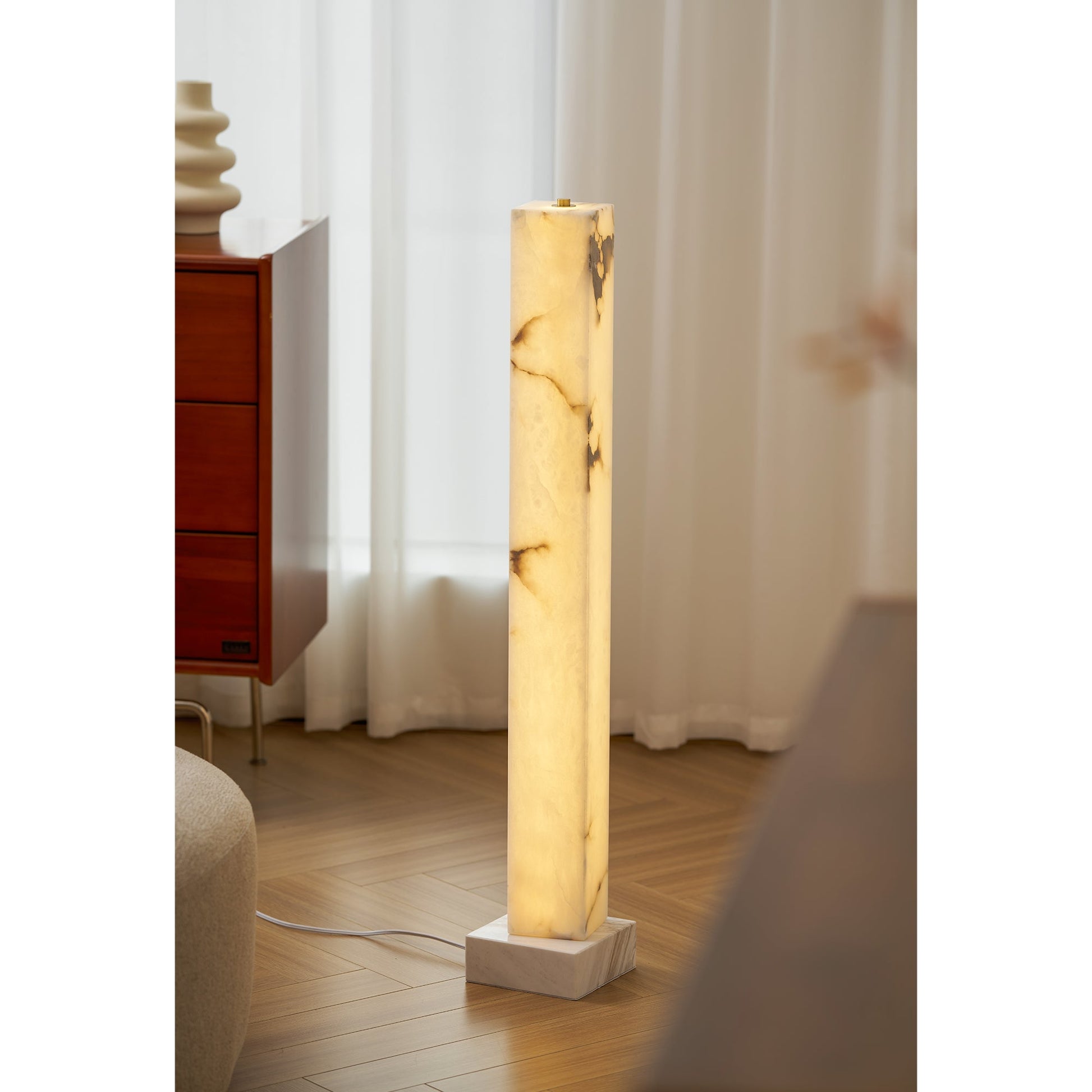 Angled shot highlighting the lamp's simple, elegant shape.