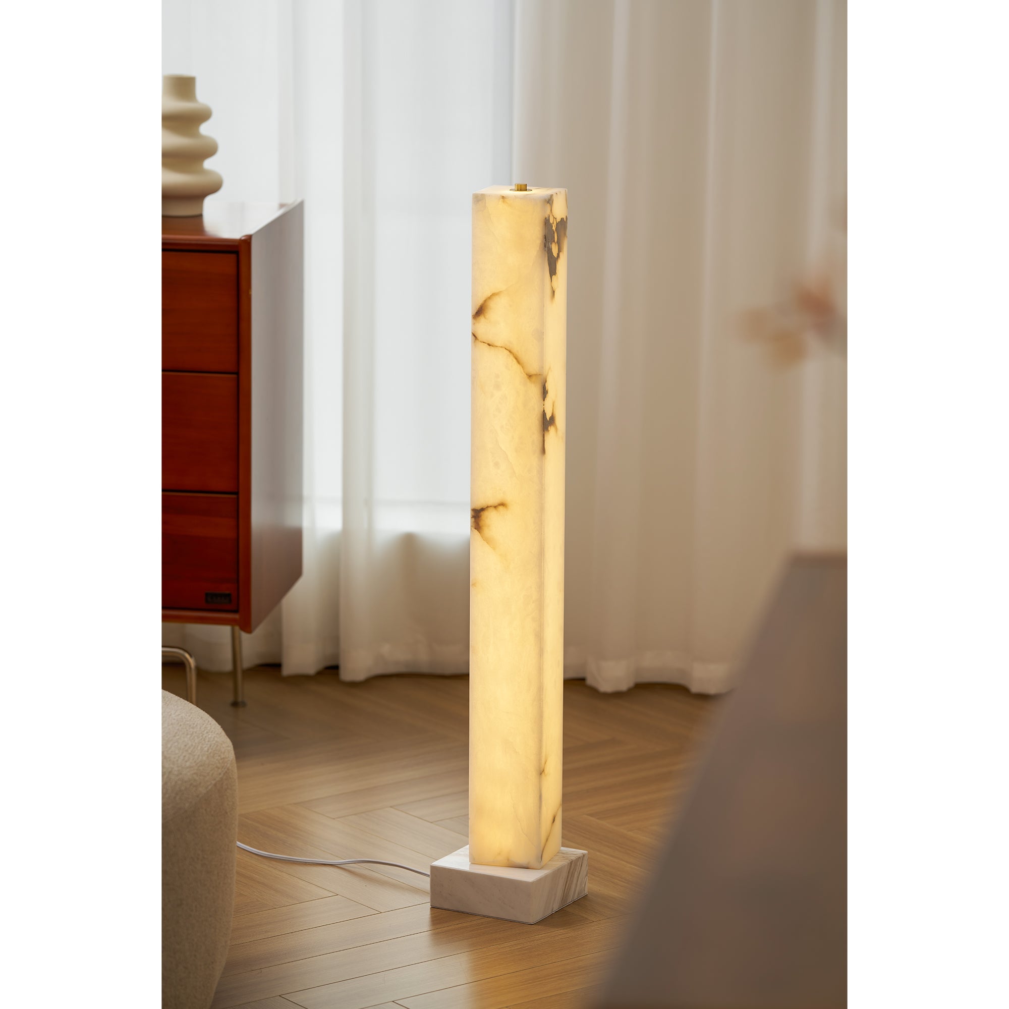 Angled shot highlighting the lamp's simple, elegant shape.