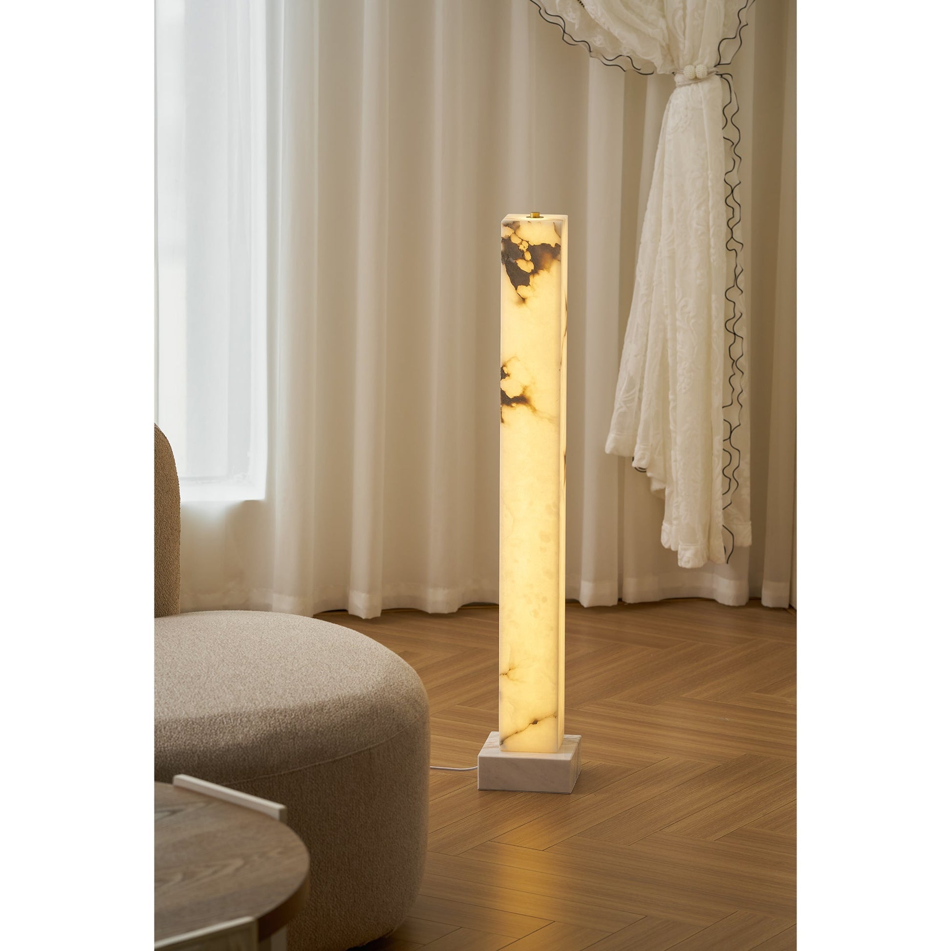 The floor lamp shown in a modern bedroom setting.