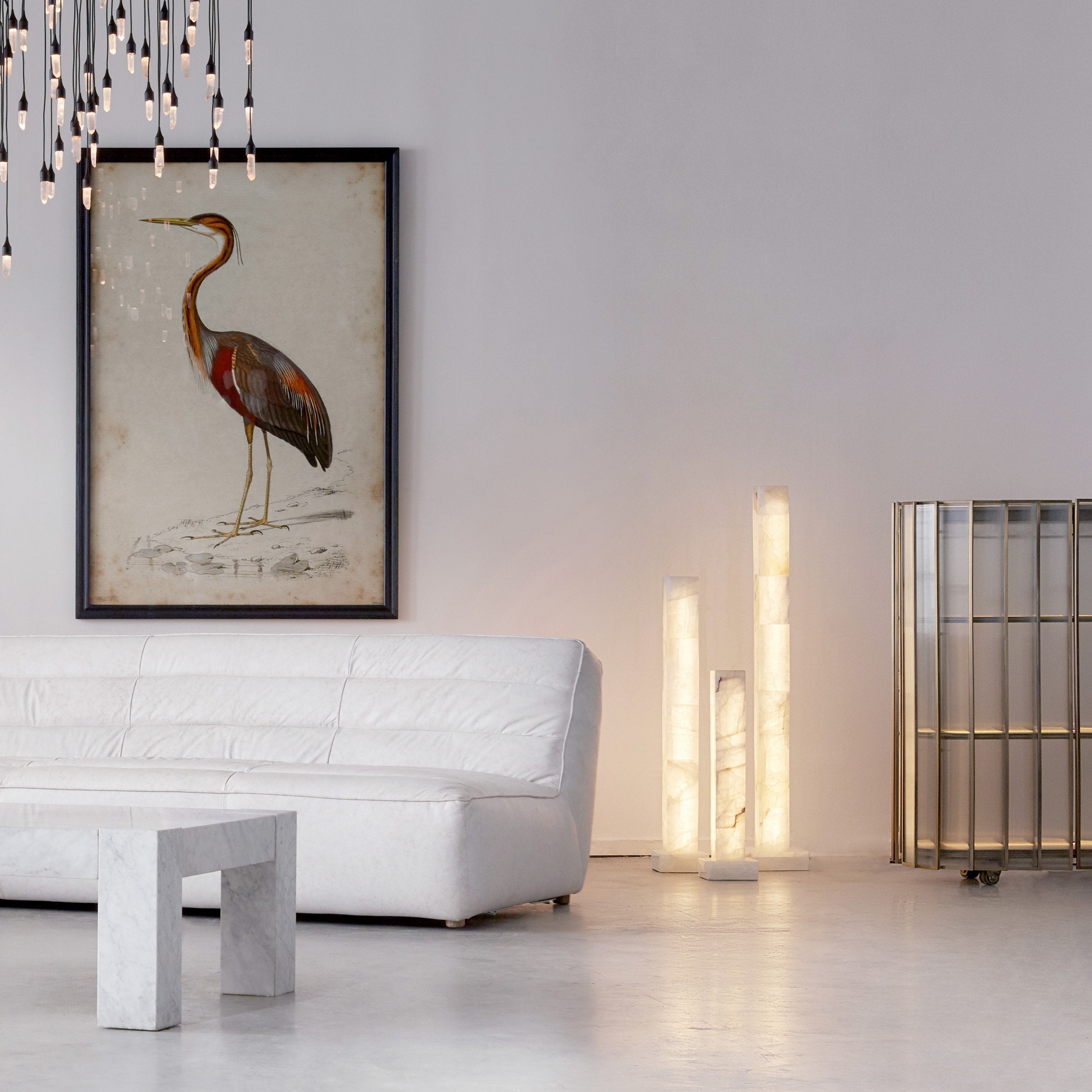 A lifestyle image with the floor lamp next to a sofa.