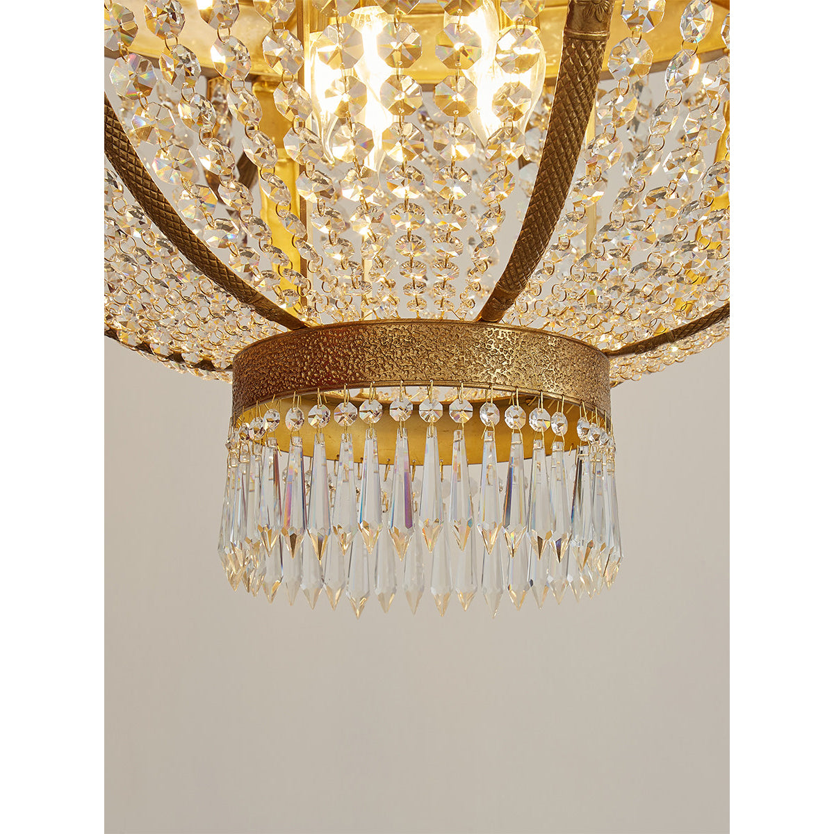 Detail of the crystal chains draping from the corona.