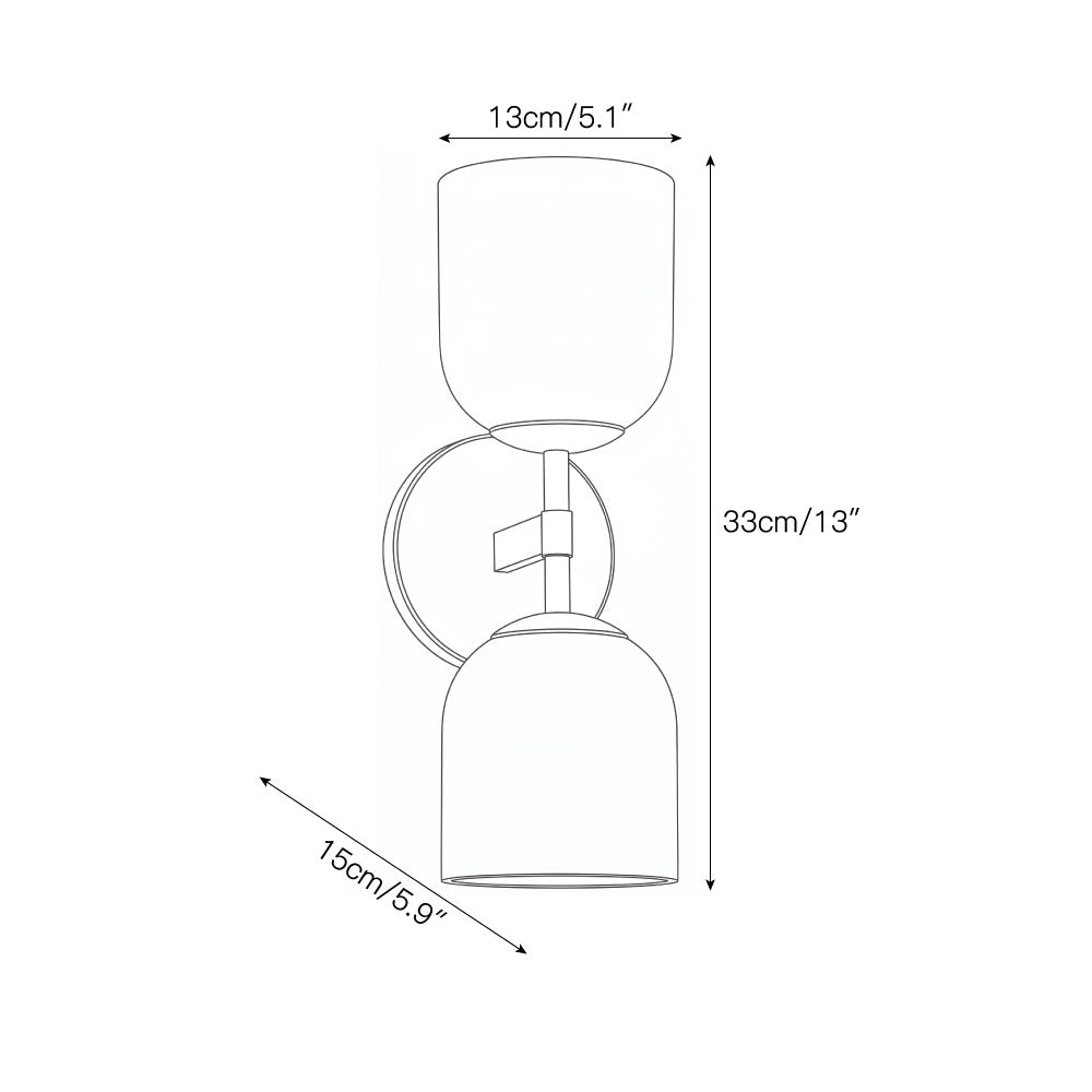 The Garrison Wall Sconce illuminated, casting a soft, warm ambient glow.