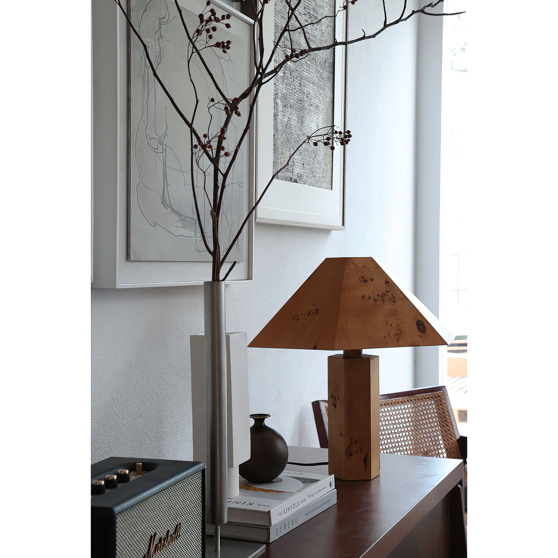 Gena Table Lamp with the light turned on, casting a soft glow.