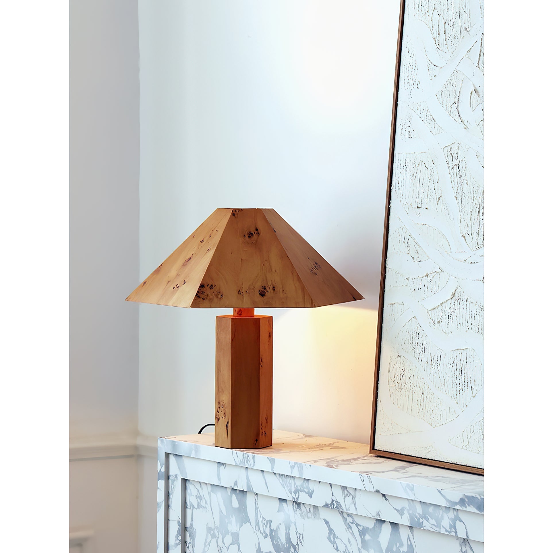 The organic shape and material of the Gena Table Lamp.