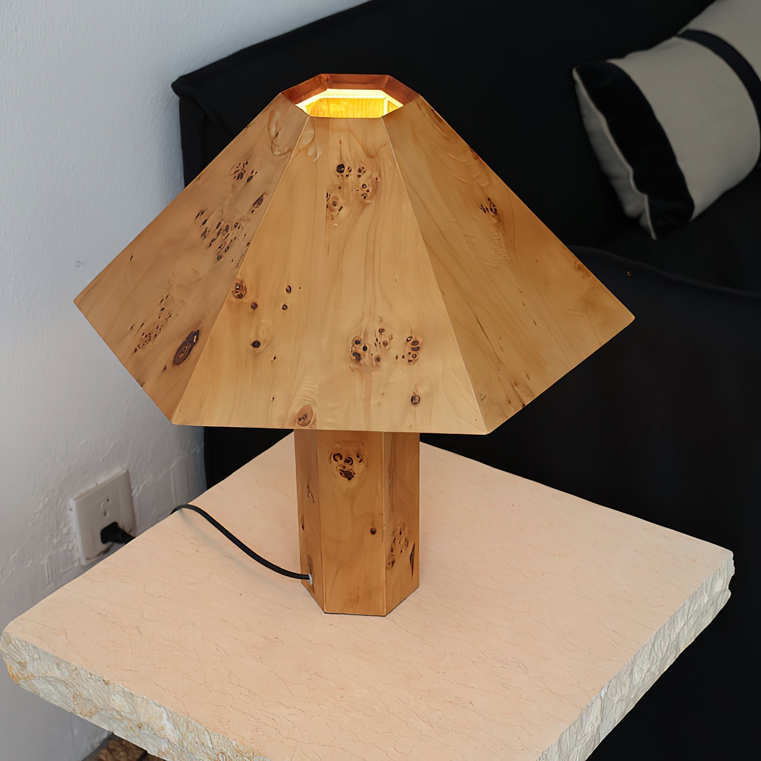 The Gena Table Lamp displayed on a console table.